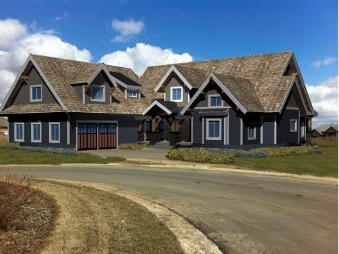 timber frame design with two car garage and wood garage doors