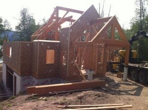 timber frame home being built with SIPs