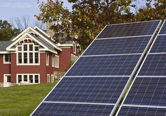 solar panels with timber frame home in the background