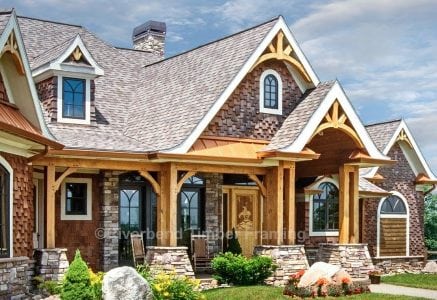 timber frame home with many exterior timber frames and stone based pillars