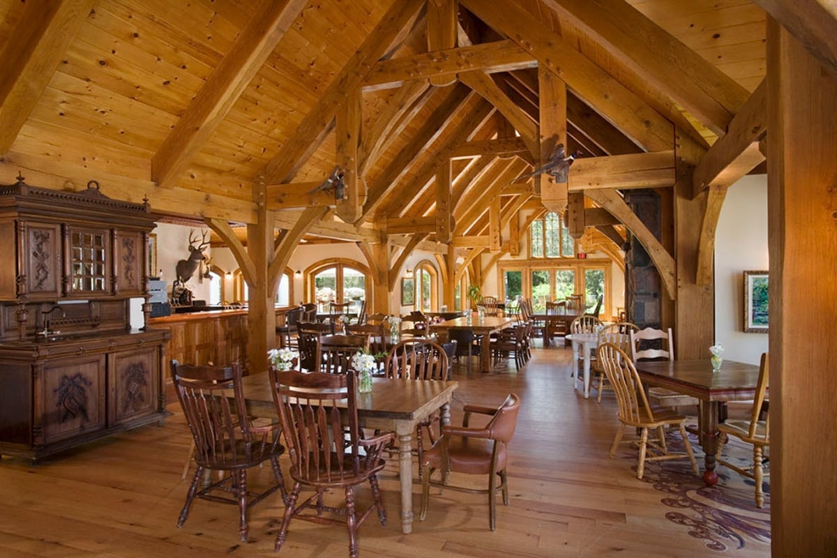 timber frame clubhouse with tables and chairs