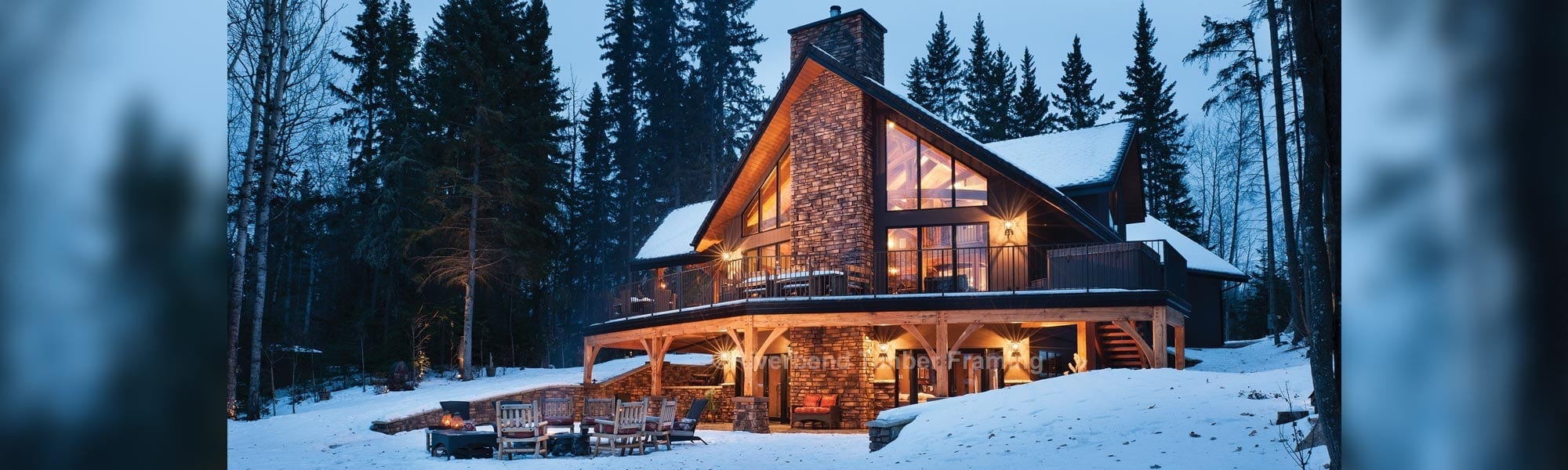 timber frame home with second floor outdoor deck in the winter