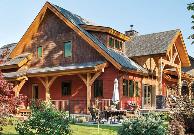 timber frame home with large front timber frame entrance and open covered porch