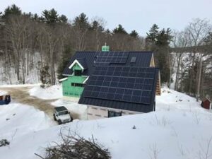 home with solar panels in the winter