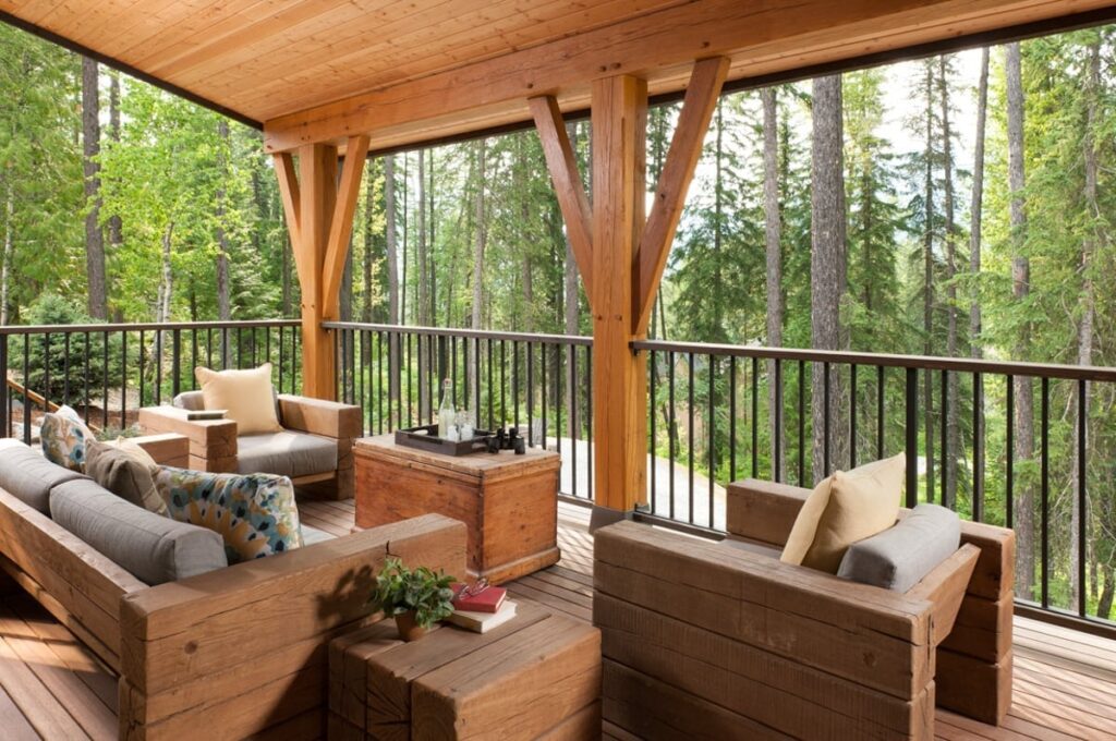 timber framed deck with wooded backyard view